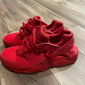 Red women’s Nike Huaraches size 7y